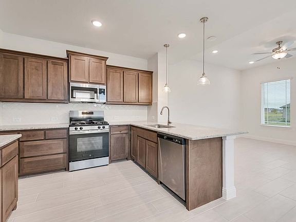 Eastholme floor plan by Pacesetter Homes featuring a 3-bedroom layout with open living and dining ar