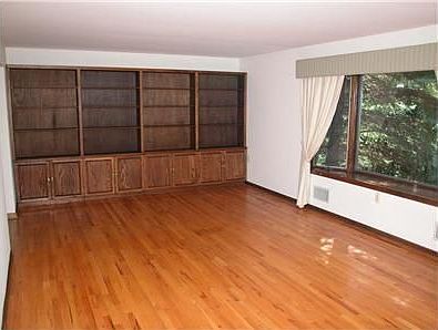 Formal living room w/ built in bookcase