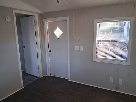 Front door entry with 1st bedroom on the right hand side.