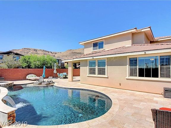 Incredible mountain views! Huge yard on a corner lot. Stunning saltwater pool&spa with pebble tec finishes, sheer descent waterfall, and travertine!