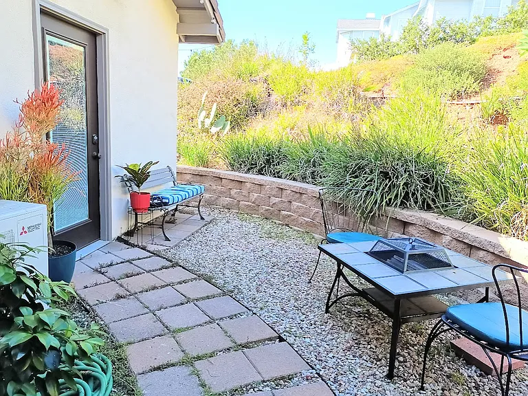 Additional private outdoor space with firepit and seating.
