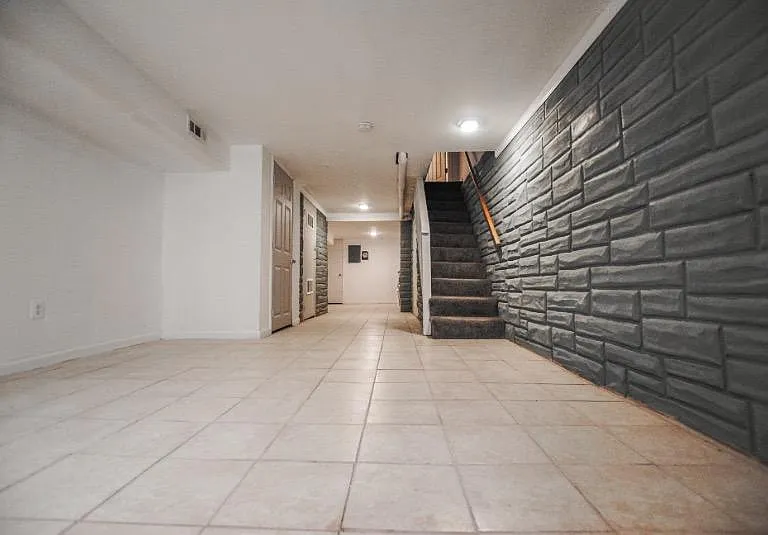 Head downstairs to the finished basement with washer and dryer