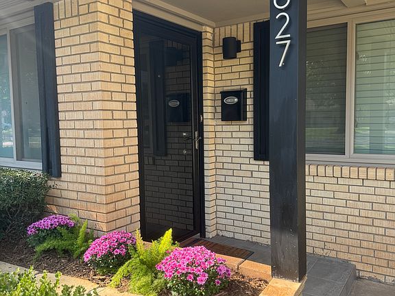 A full length storm door protects the front entry to the home. The covered, lighted porch provides convenient access to the mailbox.