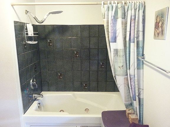 tiled bath with jacuzzi tub