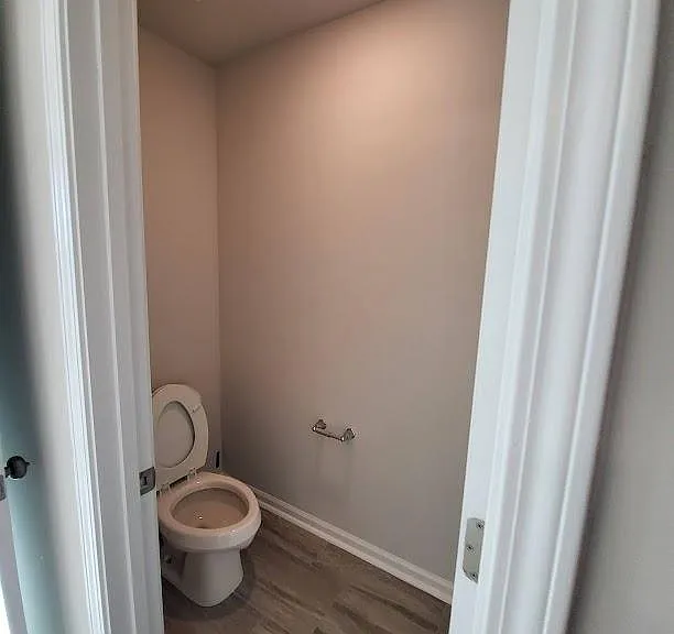 Owners commode comes with water bidet attachment.