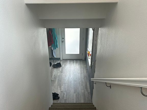 Entrance and stairs to top floor with 4 bedrooms