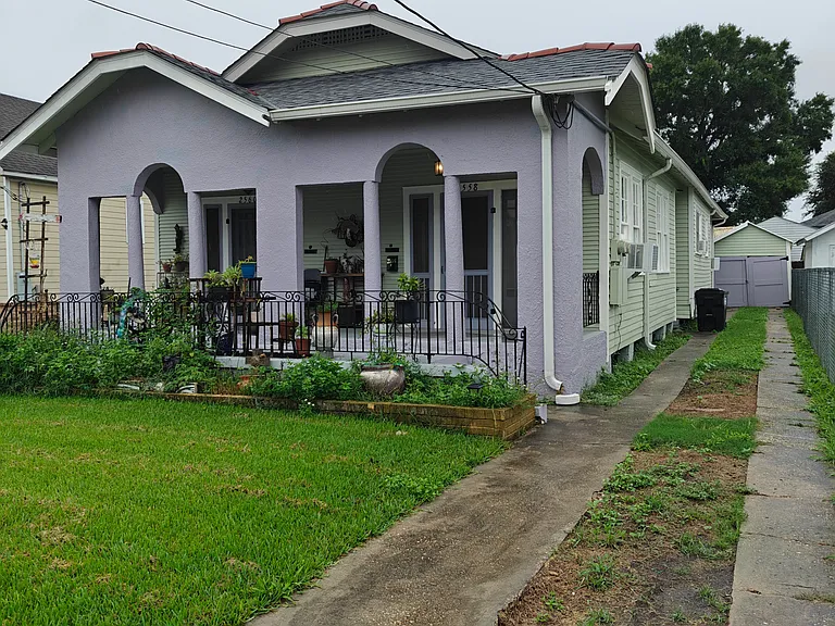 Front of the house with covered front porch and driveway