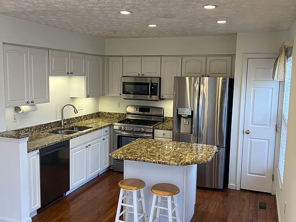 Beautiful kitchen with granite counter tops and pantry
