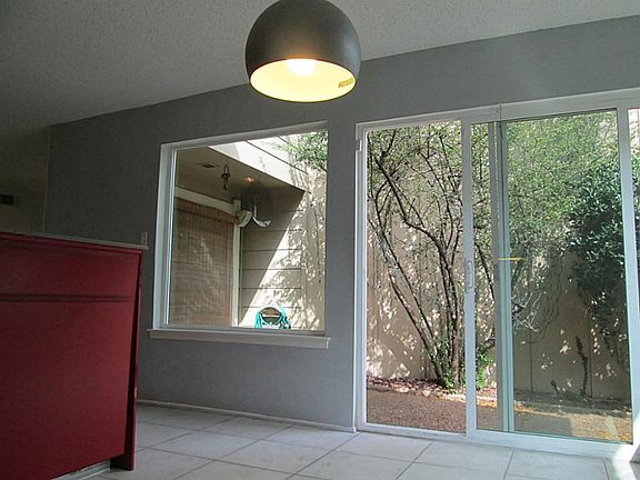 Kitchen has new energy efficient double- paned picture windows as well as sliding glass doors leadin