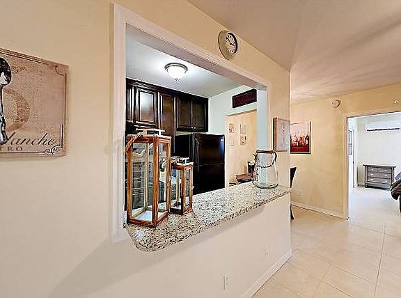 Model unit- kitchen bar area/into kitchen and dining room
