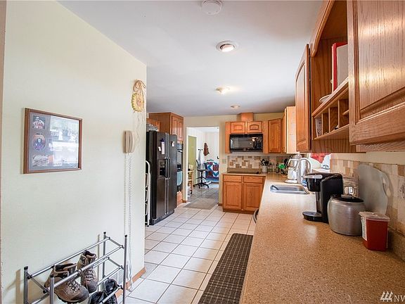 Another view of the kitchen showing all of the counter and cabinet space. 