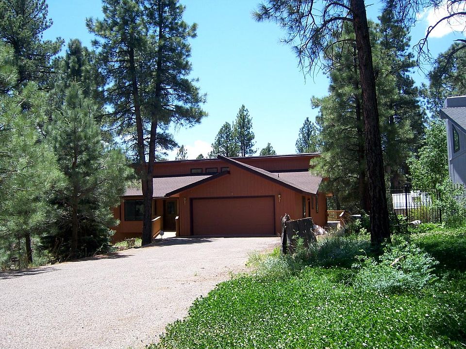 Single level home on large lot with ponderosa pine.