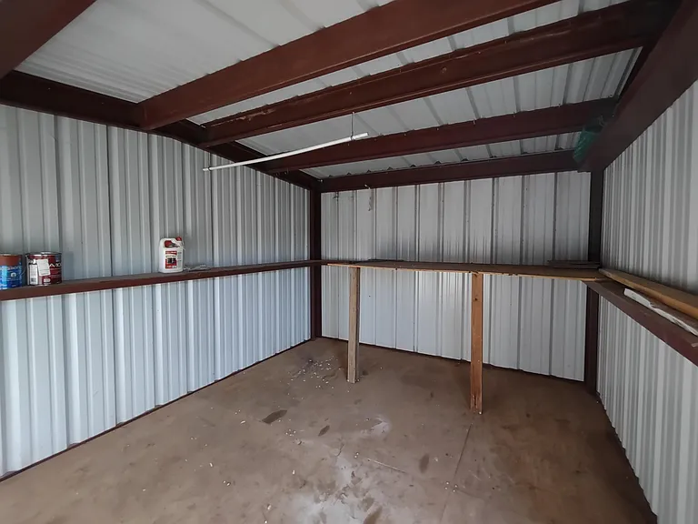 Giant storage building in back yard.