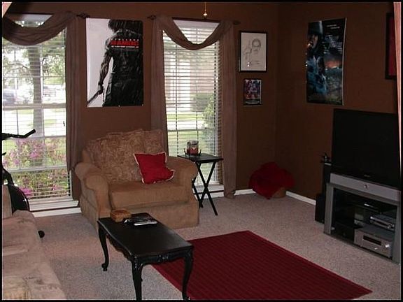   CURRENTLY USED AS A MEDIA ROOM, BUT COULD BE A FORMAL LIVING ROOM WITH BERBER CARPET AND WARM TONE PAINT COLORS
