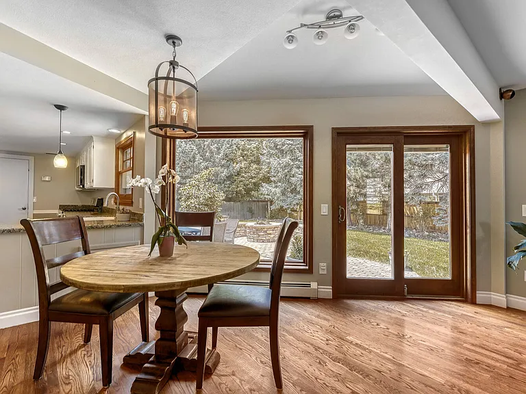 Spacious in-formal dining area with view of your custom stacked-stone gas fire pit and beautiful semi-circle bench - perfect for entertaining or smore's with the kids!