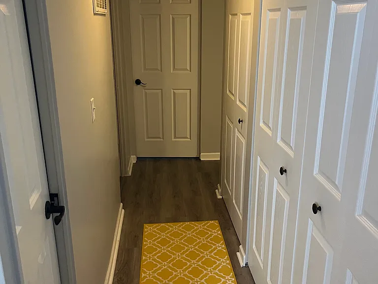 Hallway leading to the bedrooms, bathroom, laundry room and linen closet.