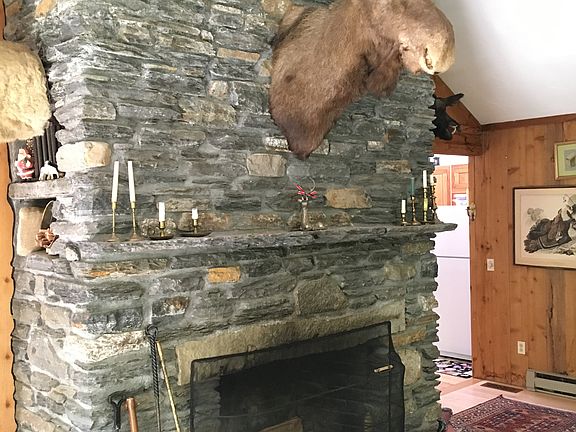 Stone fireplace in living rm