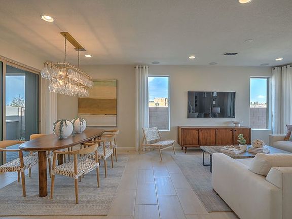 The Senita cafe and gathering room designed with neutral tones of tile flooring and paint detail.