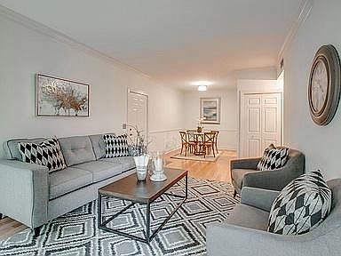 Living/dining area with fireplace/gas logs.