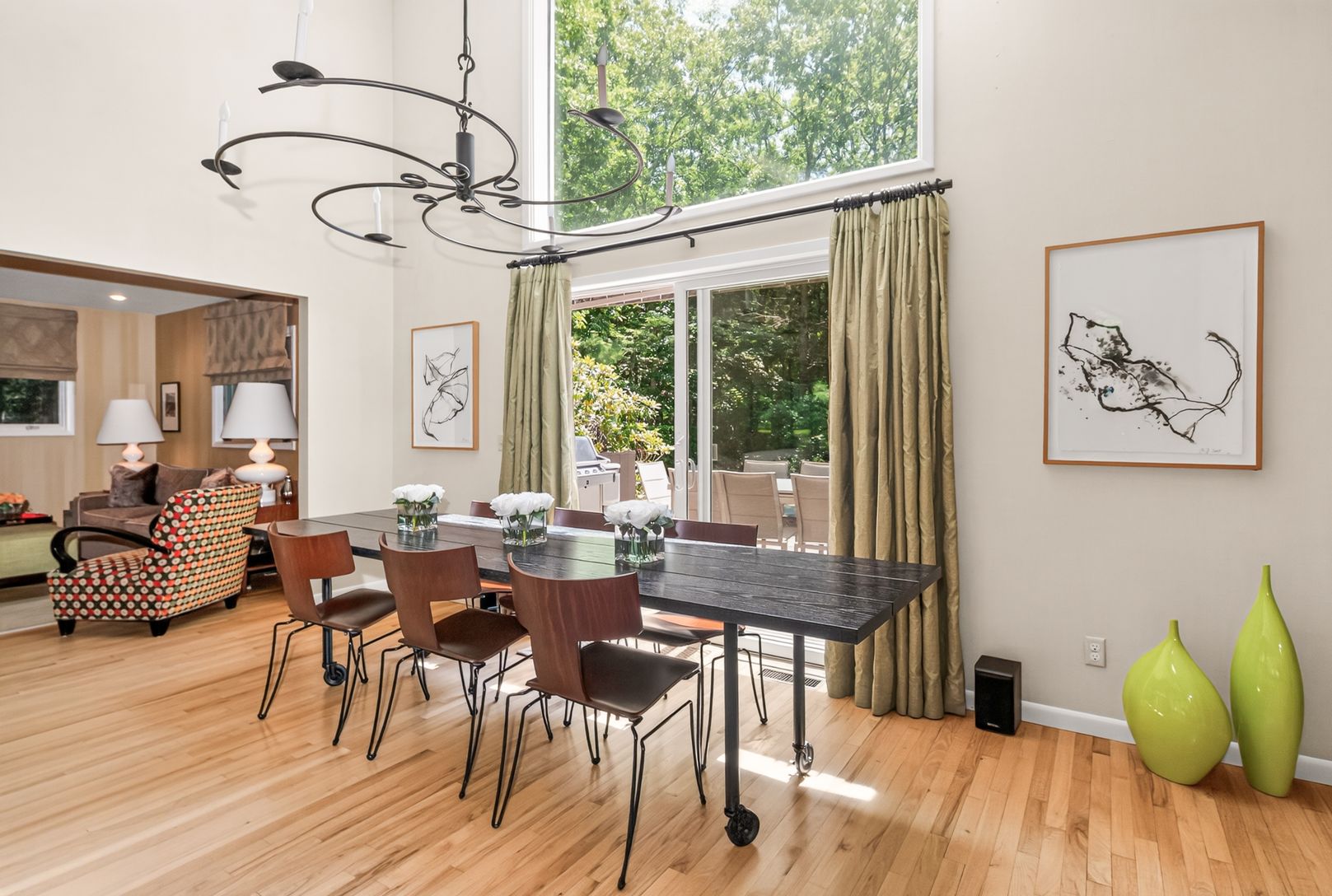 Dining area overlooks rear patio and pool