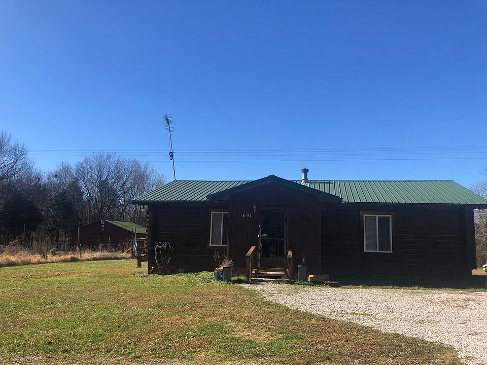 Front. Uncovered parking.