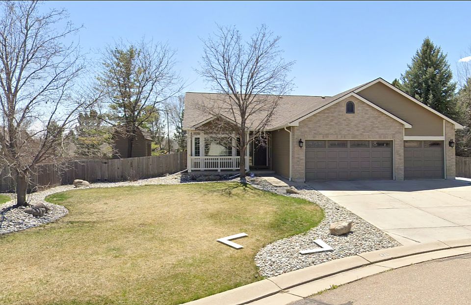 Charming brick-front home with a welcoming covered porch and mature trees offering curb appeal and shade. Features a spacious 3 car garage, wide driveway, and low-maintenance rock landscaping with a manicured lawn_set on a quiet corner lot in a peaceful