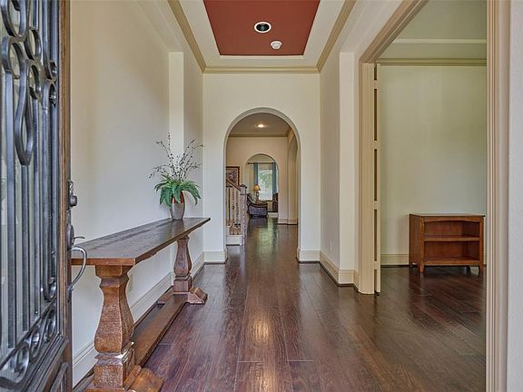 The rich wood floors, soaring ceilings and stunning architectural design captivate your attention as you walk through the door.