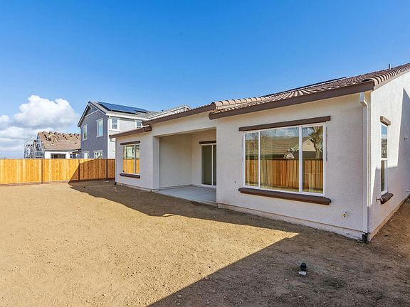 Backyard with covered patio area