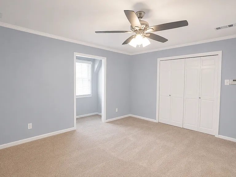 master bedroom with 3 closets (2 walk in)