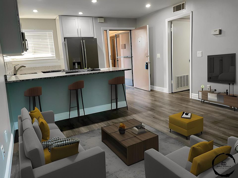 Open concept living room & kitchen. Large laundry room for storage and convenience.