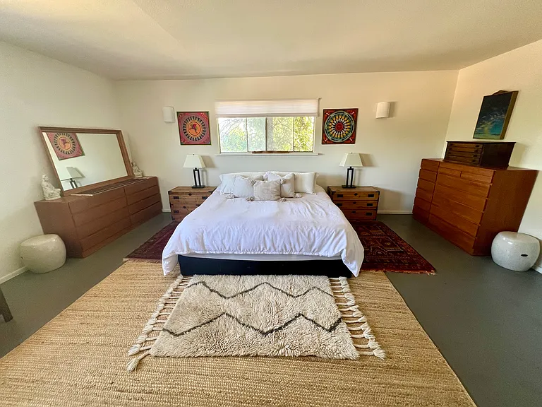 Master bedroom with antique furniture from Japan and Scandinavia.