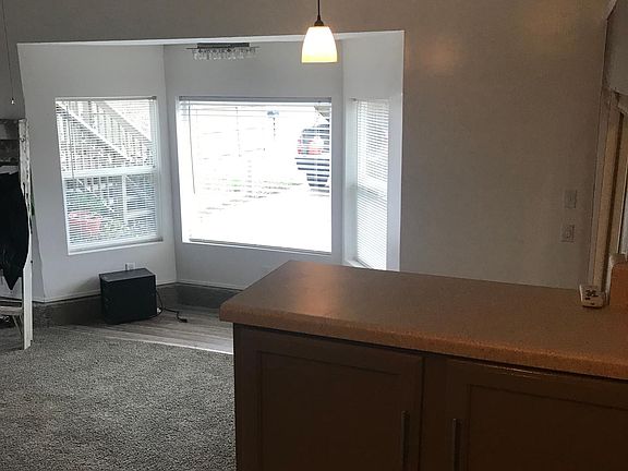 Bay window in living room. Photo taken from kitchen