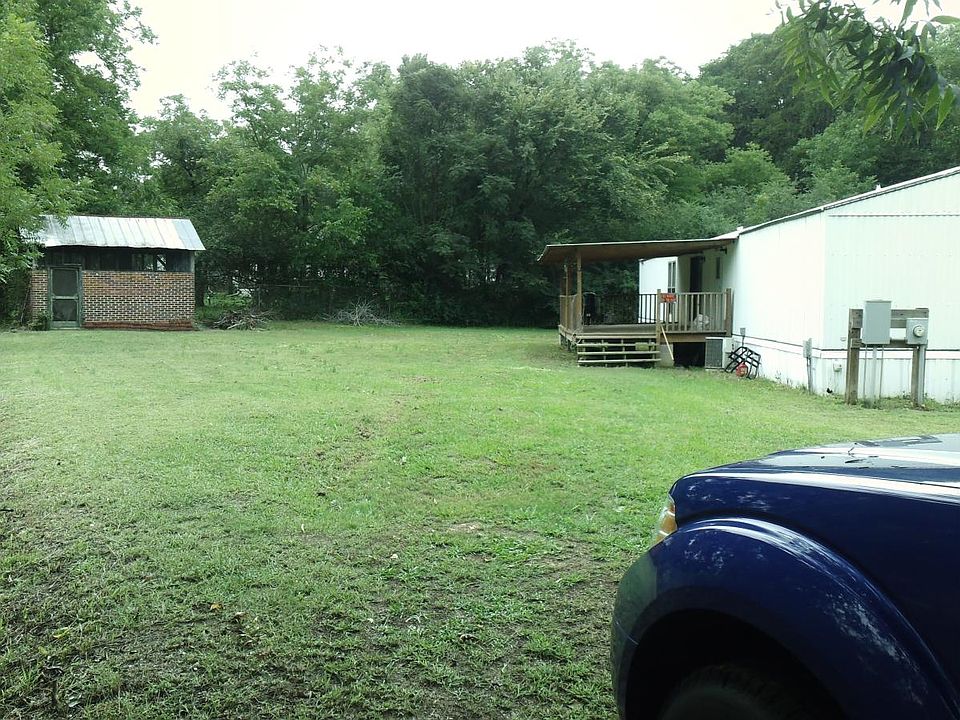Smokehouse and 1/2 acre lot fenced