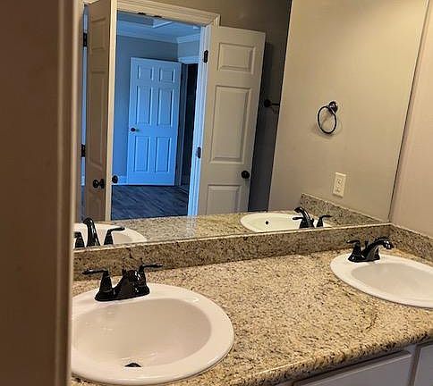 Double sinks and granite counter top in Master Bathroom