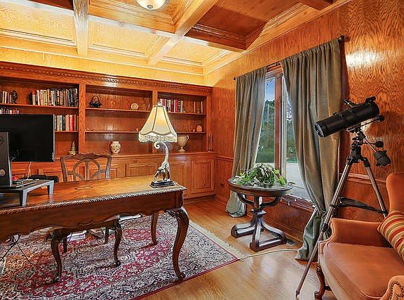 Executive office space,vaulted coffered ceilings,  built-in shelving, cabinetry.