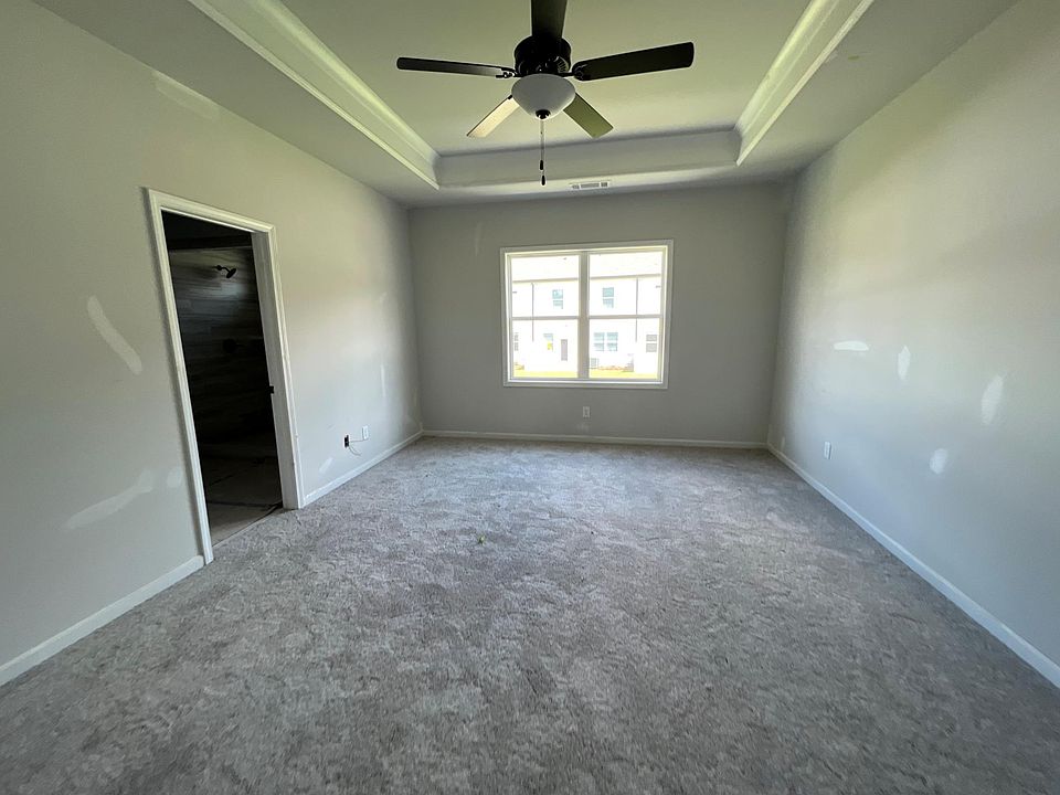 spacious master bed with fan