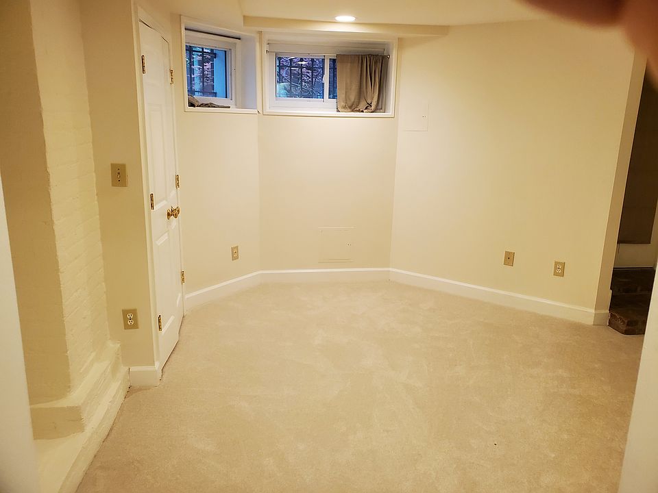 Living room space view from kitchen showing two windows facing Park Rd.