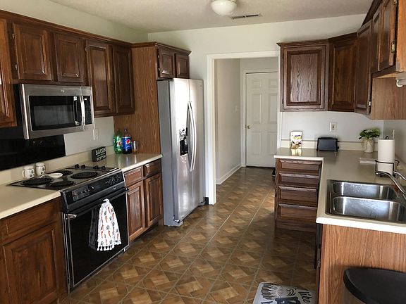Kitchen with Door leads to garage