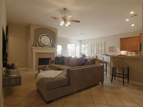 AS YOU ENTER THE HOME YOU ARE WELCOMED BY THIS LARGE DEN WITH FIREPLACE.