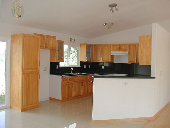 Kitchen is full a beautiful maple cabinets and granite countertops.