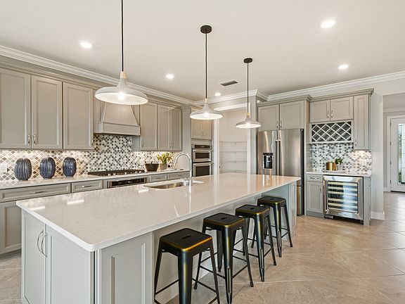 Kitchen with Large Center Island and Optional Entertainment Package