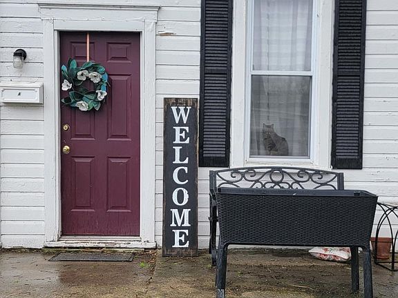 Front door entrance with street parking.