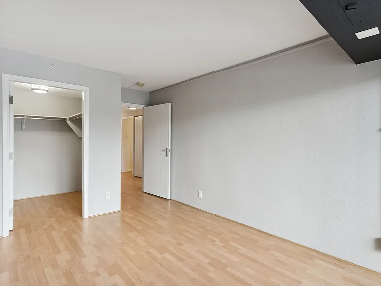 Bedroom 2 with balcony and walk-in closet.