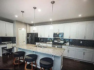 granite countertops, white cabinet. Lots of space