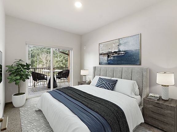 Red Cedar Furnished Guest Bedroom and Balcony