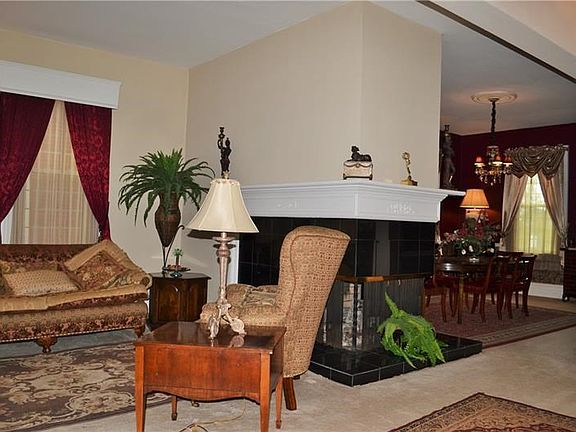 Upon entering you are greeted by this gorgeous granite wrap around fireplace.