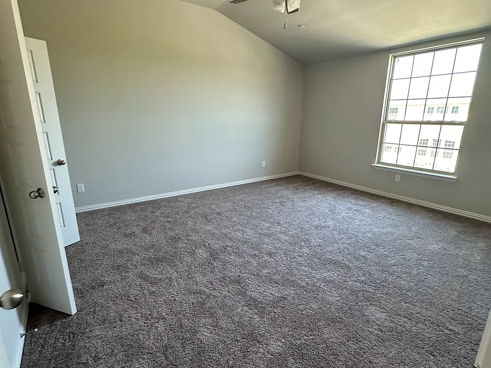 Gorgeous primary bedroom with high ceiling and huge windows to let in the light and keep you fresh in the morning. Includes a connected ensuite bathroom and spacious walk-in closet.