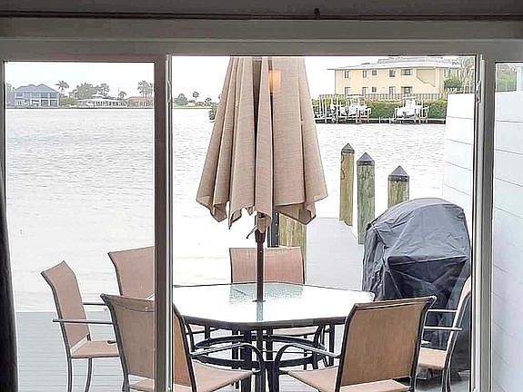 Private deck and dock with dining table and grill
