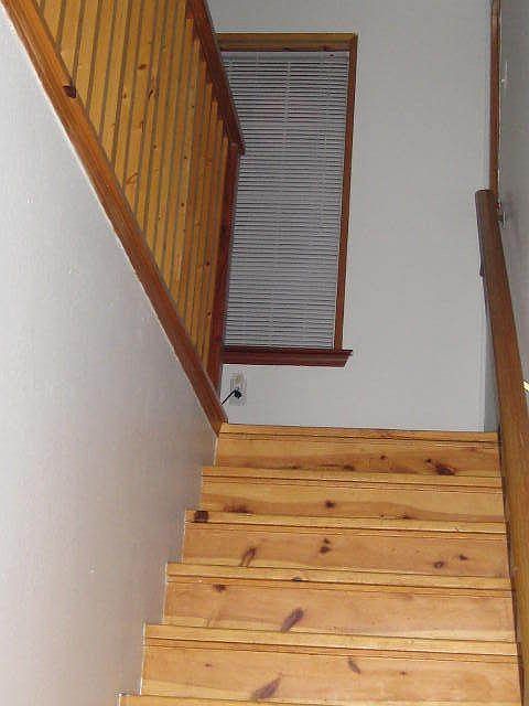 pineplank stairs and flooring upstairs with half bath