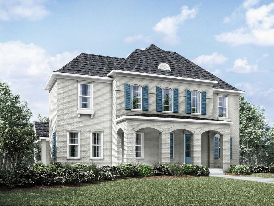 two-story home with arched entrance